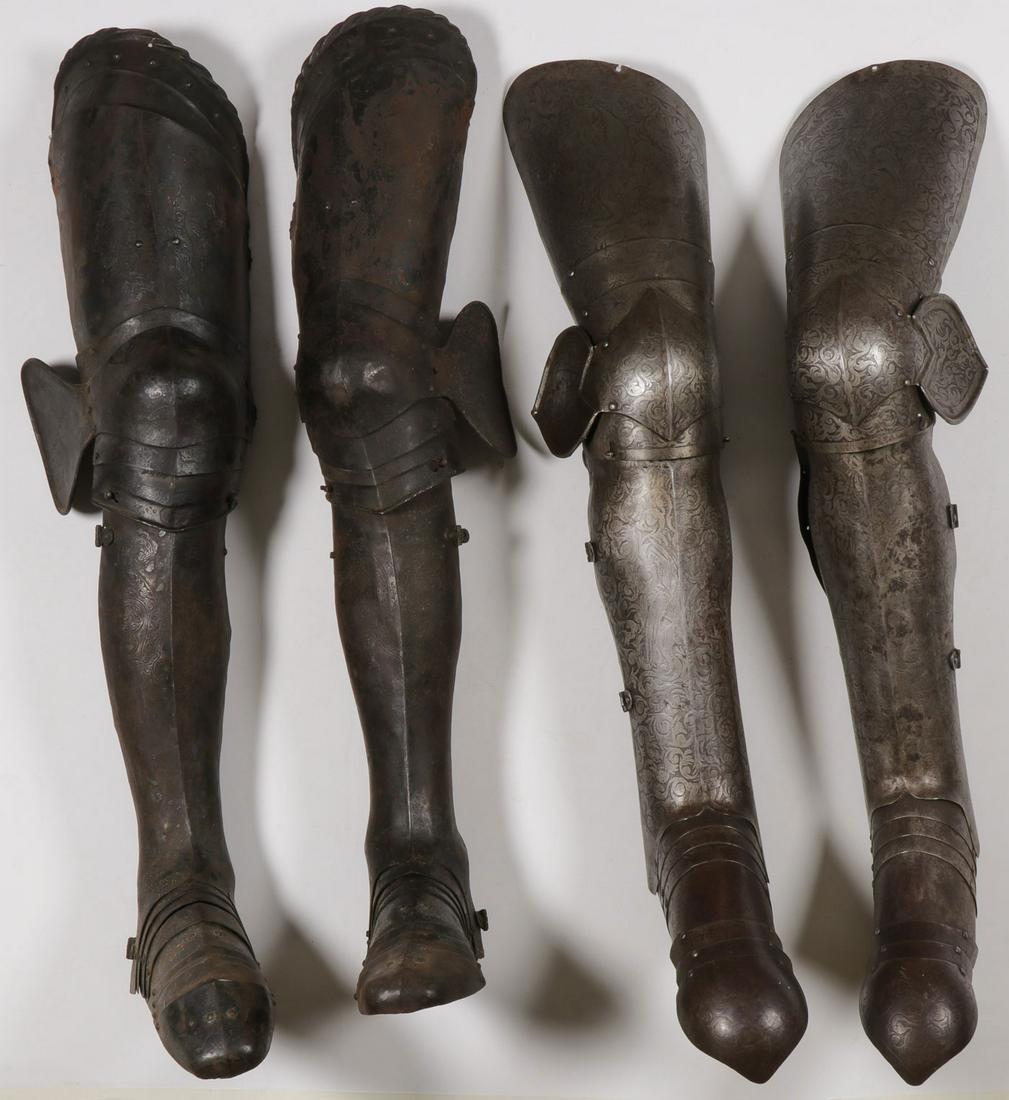 ENGRAVED VICTORIAN ARMOR, 19TH C: ENGRAVED VICTORIAN ARMOR, 19TH C. Comprising two pairs of matching medieval style leg armor, each with heavily engraved surfaces, each pair consisting of a cuisse, poleyn and fan plate, grieves, and l