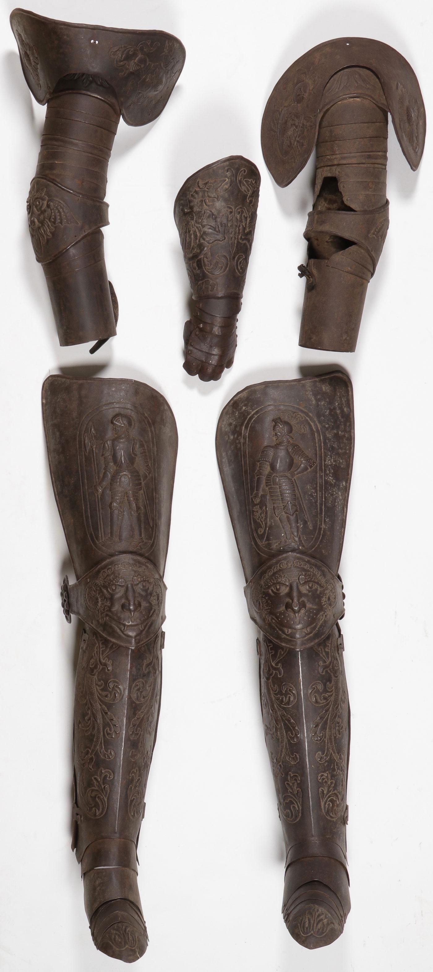 VICTORIAN ARMOR SET: VICTORIAN ARMOR SET. Comprising a matching set of Victorian leg and arm armor, each piece with ornate repoussé designs. The leg armor consisting of matching cuisse, poleyn and fan plate, grieves, and