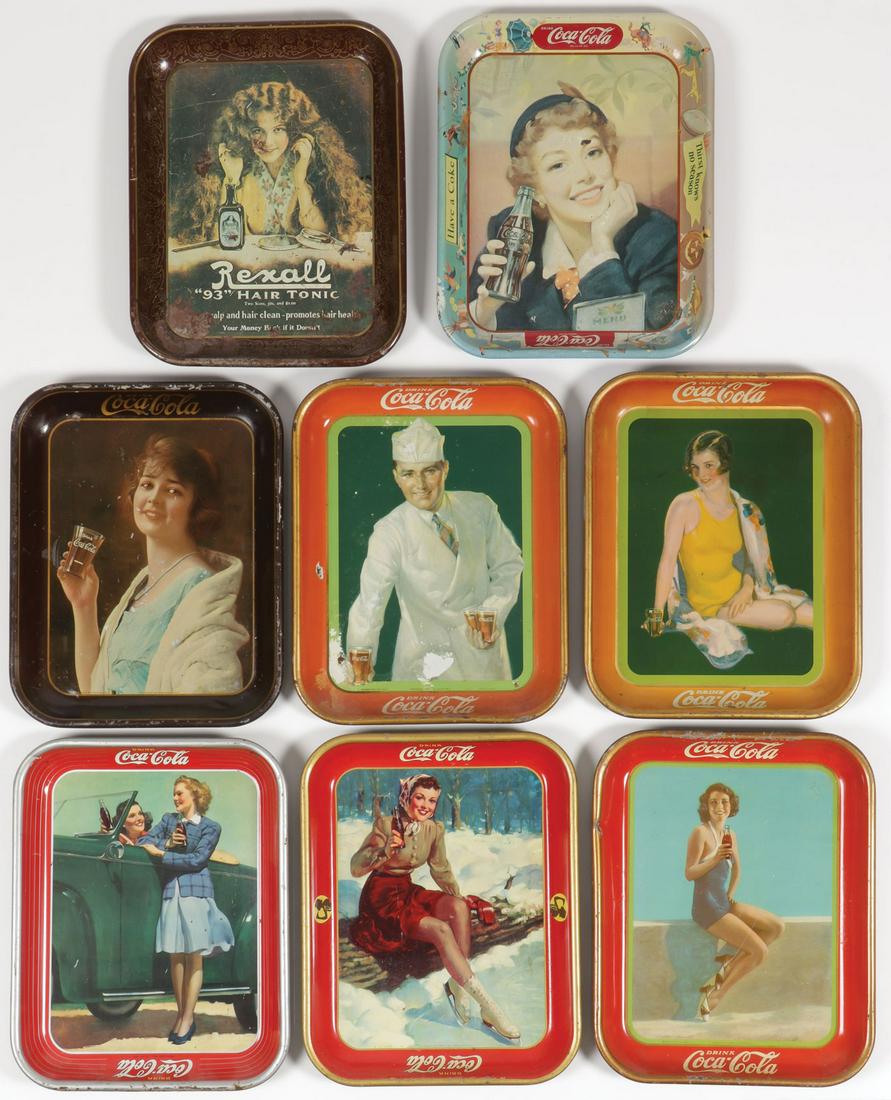 SIX VINTAGE COCA-COLA TRAYS, CIRCA 1920-1950: SIX VINTAGE COCA-COLA TRAYS, CIRCA 1920-1950. Comprising various trays including a 1923 example, as well as a Rexall Hair Tonic tray. Each approximately 13 inches, and in various states of condition. 