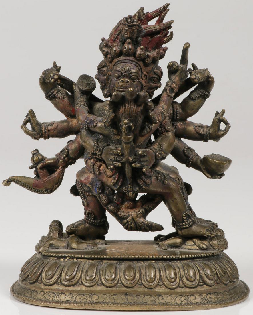 SINO-TIBETAN BRONZE FIGURE OF YAMANTAKA: SINO-TIBETAN BRONZE FIGURE OF YAMANTAKA . Finely sculpted in the form of the yidam and consort standing in alidhasana on trampled figures, with traces of polychrome, atop a sealed lotus base engraved 