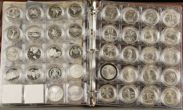 116 PIECE U.S. COMMEMORATIVE SILVER DOLLAR COLLEC: A 116 PIECE U.S. COMMEMORATIVE SILVER DOLLAR COLLECTION, complete MS and Proof issues for 1983 through 2007. Contained in an Eagle album. Includes all MS 1996 Olympics and 2001 Buffaloes. Estimate $4,