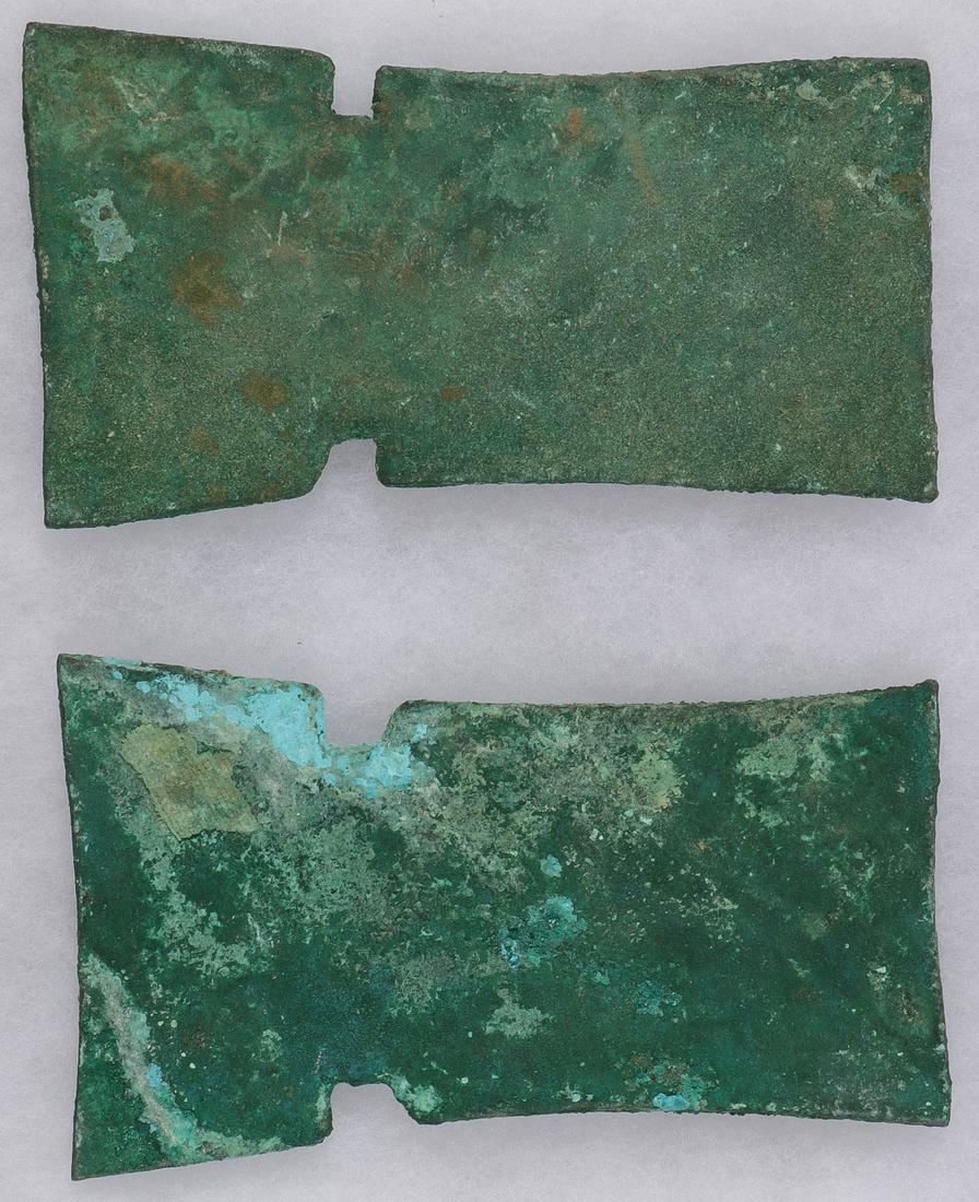 TWO PRE-COLUMBIAN BRONZE AXE FORMS: TWO PRE-COLUMBIAN BRONZE AXE FORMS. Comprising two bronze or copper preform axe heads (unsharpened) each thick and heavy and with natural verdigris patina overall. Greatest length 6 inches (15.5 cm). 