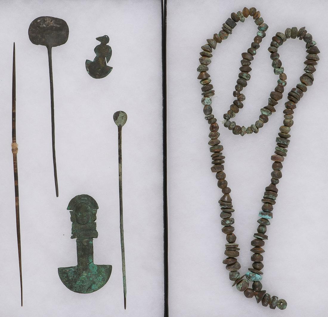 INTERESTING PRE-COLUMBIAN BRONZE ARTIFACTS: INTERESTING PRE-COLUMBIAN BRONZE ARTIFACTS. Comprising five individual, hand-crafted (likely Moche) bronze or copper articles as well as an extensive bronze beaded necklace. Including a tumi with figu