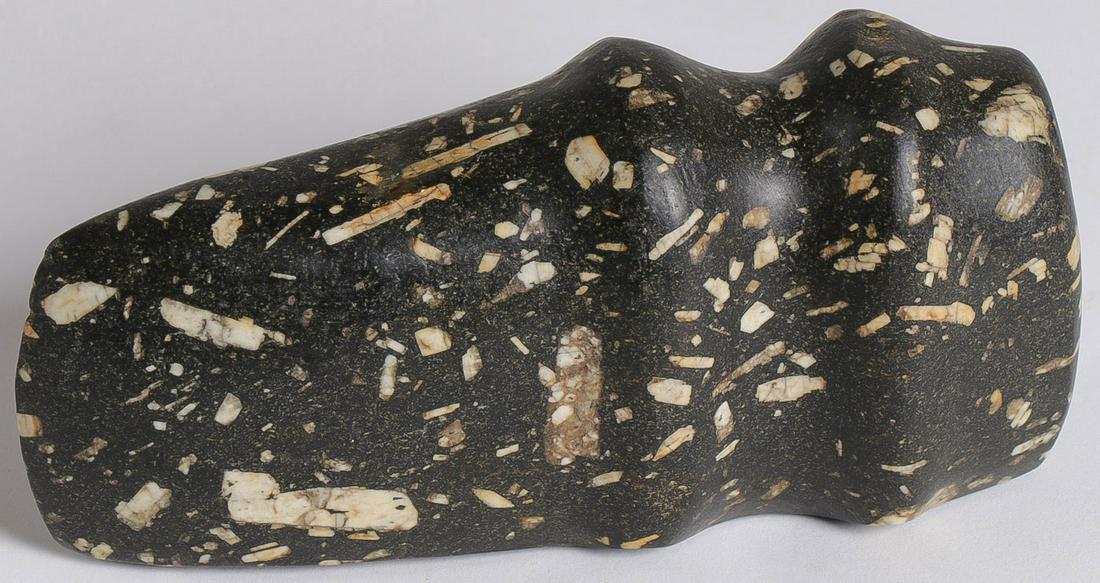 A GOOD 3/4 GROOVE PORPHYRY AXE: A GOOD 3/4 GROOVE PORPHYRY AXE. Of good form and with polished surface. Length 6.1 inches (15.5 cm). SHIPPING NOTICE: Jackson's is your sole and only source for one stop packing and shipping. Wit