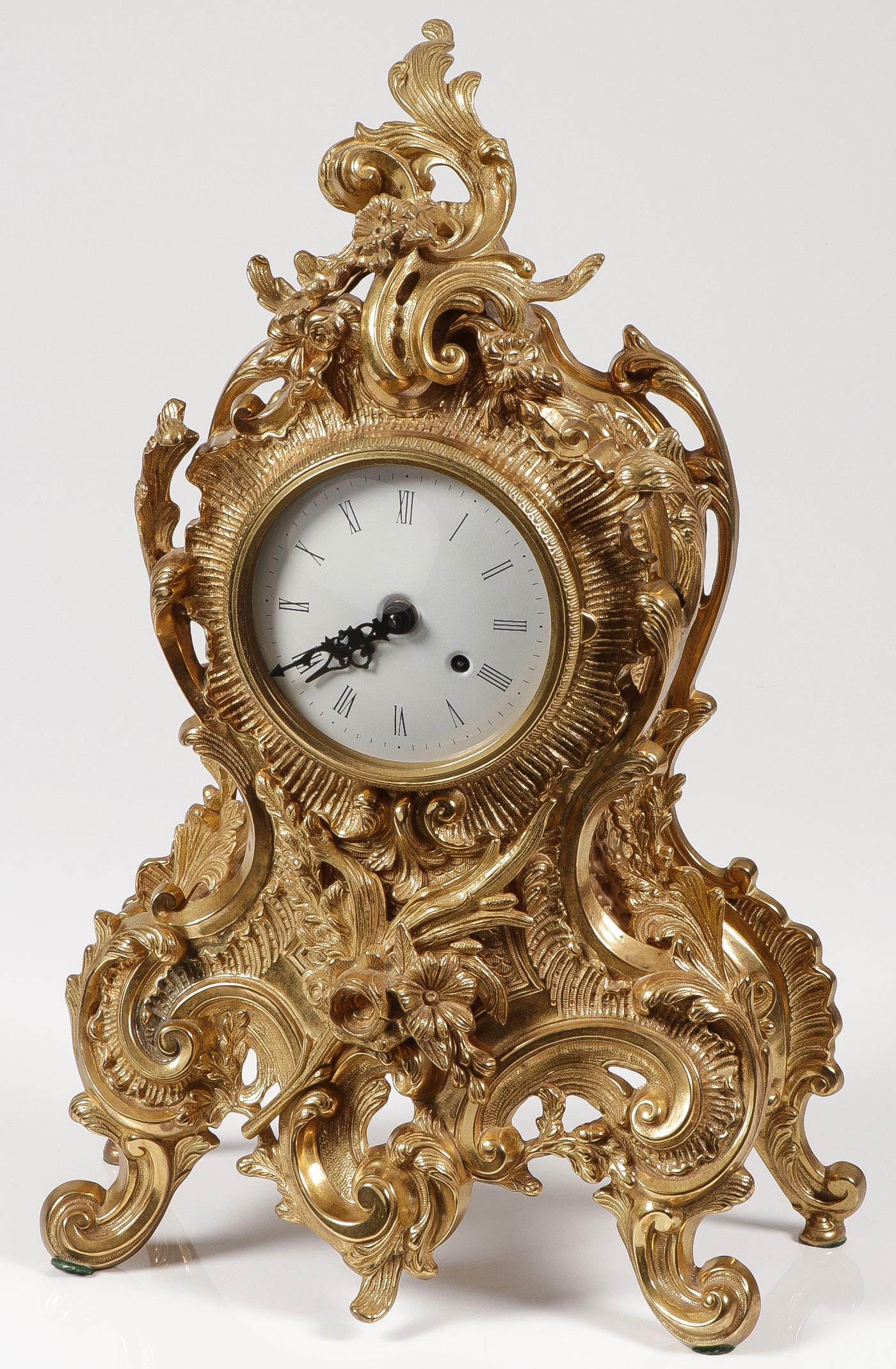 A LOUIS XV STYLE BRONZE MANTLE CLOCK: A LOUIS XV STYLE BRONZE MANTLE CLOCK. Comprising a large and impressive polished bronze case in the Louis XV taste, the works marked Franz Hermle, height 21 inches. SHIPPING NOTICE: Jackson's is yo