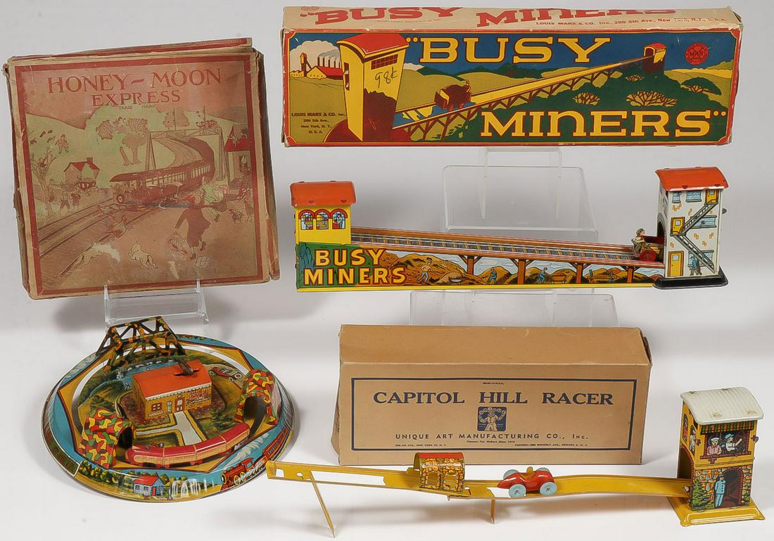 THREE VINTAGE TIN WIND-UP TOYS WITH BOXES: THREE VINTAGE TIN WIND-UP TOYS WITH BOXES. Comprising a good Marx Busy Miners, a Marx Honey-Moon Express, and a Unique Art Capitol Hill Racer. Each with original box (in various states) and each fully