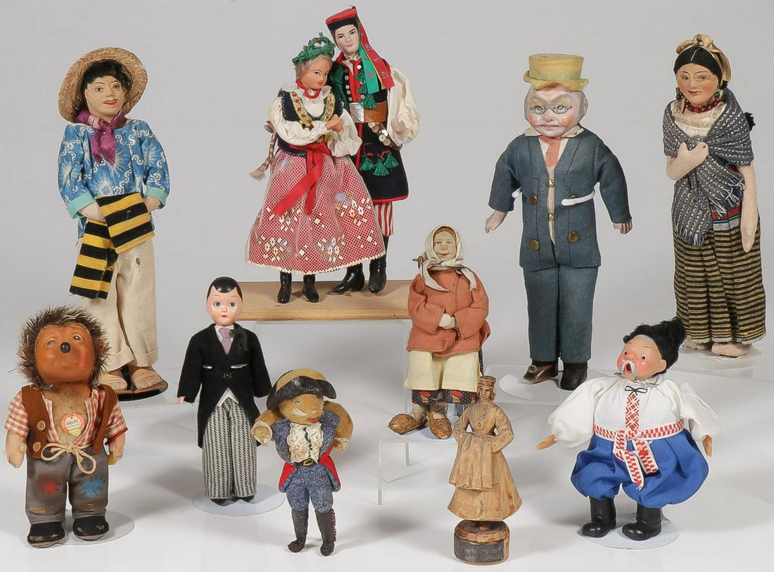 11 VINTAGE DOLLS: 11 VINTAGE DOLLS. Comprising mostly costume dolls, including a Polish wedding couple, a Ukranian man, a Russian lenci style doll with birch bark shoes, a German papier-mache gentleman, a Latin Americ