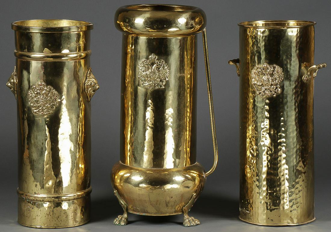 IMPRESSIVE RUSSIAN BRASS UMBRELLA STANDS: IMPRESSIVE RUSSIAN BRASS UMBRELLA STANDS. Comprising three large and impressive hand-crafted brass umbrella stands, each emblazoned with the Imperial Double Headed Eagle, and the underside of each sta