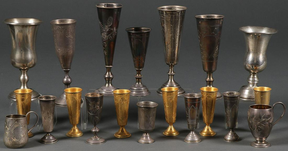 RUSSIAN SILVER GROUP, CIRCA 1900: RUSSIAN SILVER GROUP, CIRCA 1900. Comprising 20 individual Russian Imperial period silver beakers, cordials, and other drinking vessels, including footed examples, most with engraved decoration, all w
