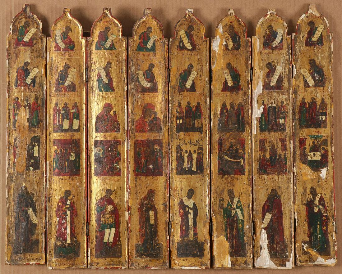 A RUSSIAN FOLDING ICONOSTASIS 19th C: A RUSSIAN FOLDING ICONOSTASIS 19th C. Comprising a partial folding or traveling iconostasis of the type often used in the field in battle with military chaplains. Comprising eight shaped carved wood p