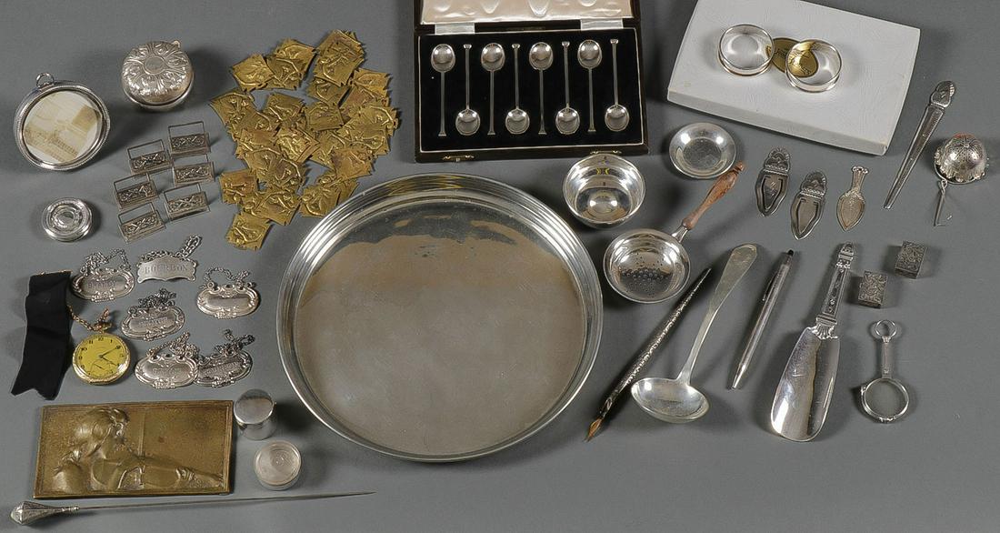 A TIFFANY SILVER & OTHER SMALLS GROUP: A TIFFANY SILVER & OTHER SMALLS GROUP. Comprising 50 individual pieces including a Tiffany pewter tray, 10 inches, a set of eight Reed & Barton napkin rings, a Tiffany sterling cream spoon, a Tiffany