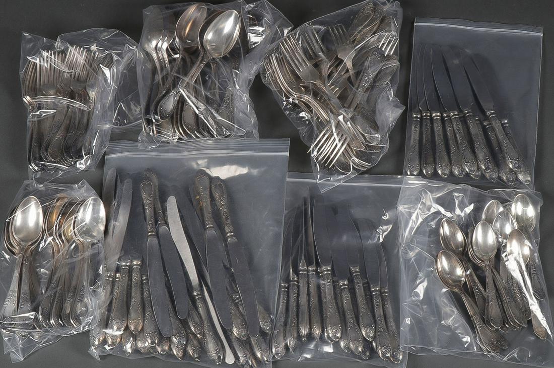 AN ATTRACTIVE SOVIET FLATWARE SET: AN ATTRACTIVE SOVIET FLATWARE SET. Comprising a large and impressive silver-plated ornate flatware set consisting of 178 matching pieces comprising 22 small forks, 27 large forks, 14 small knives, 12 