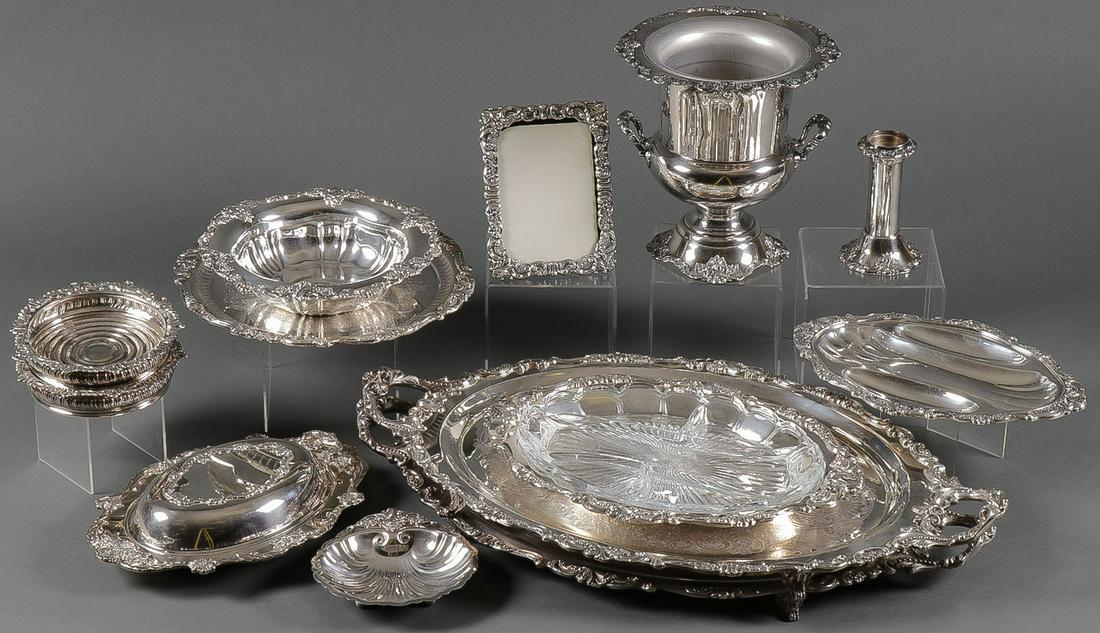 A LARGE WALLACE BAROQUE SILVER PLATE GROUP: A LARGE WALLACE BAROQUE SILVER PLATE GROUP Comprising 13 individual pieces, most if not all in the Baroque pattern and most all marked Wallace, including a Wallace Baroque champagne bucket, two footed