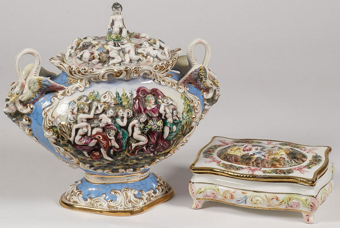 CAPODIMONTE URN AND BOX: CAPODIMONTE URN AND BOX. Comprising two large and impressive ornate examples with gilt embellishment, the double handled urn with fitted lid decorated with raised intertwining maidens and putti, heig