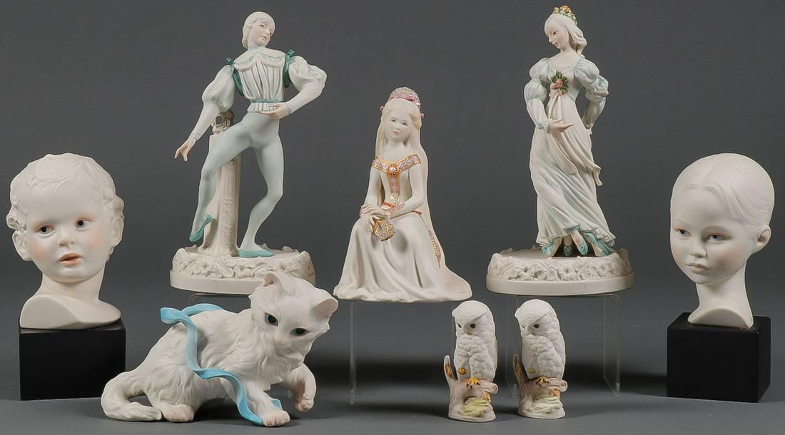 7 CYBIS BISQUE FIGURINES: 7 CYBIS BISQUE FIGURINES. Comprising a dancing couple, a seated maiden, a recumbent cat, a bust of young boy and girl each mounted on a low black socles, together with a pair of "Baby Owl" figurines,