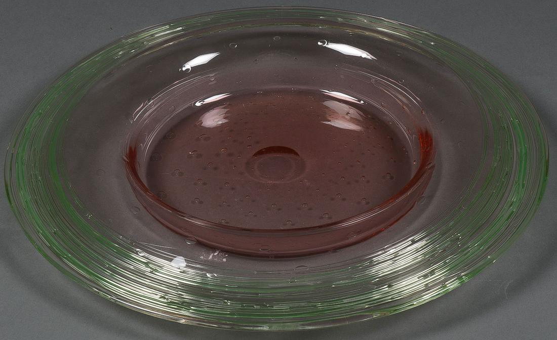 A LARGE CENTER BOWL, STEUBEN?: A LARGE CENTER BOWL, STEUBEN? Comprising a low wide bowl having a pale green spun wide flanged lip centering a red depressed well with patterned controlled bubbles, and polished pontil, apparently uns