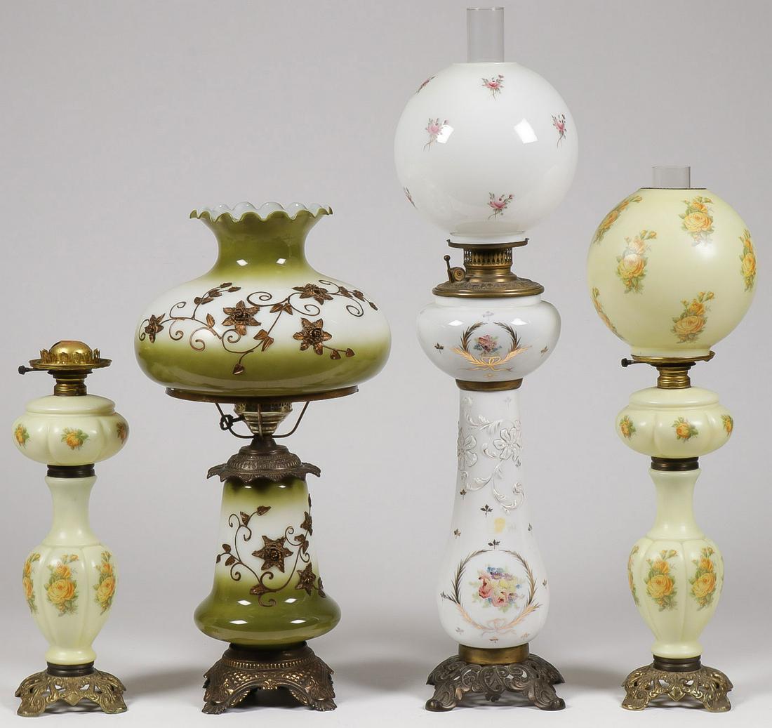 GONE WITH THE WIND LAMP GROUP: GONE WITH THE WIND LAMP GROUP. Comprising four electric gone with the wind style lamps including a large example in white opaque glass with floral and gilt decoration and lift out font and ornate vas