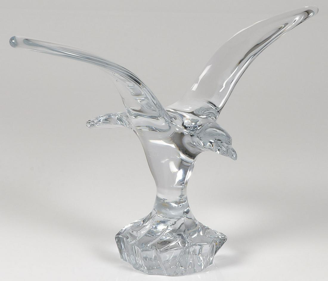 A DAUM CRYSTAL BIRD SCULTPURE: A DAUM CRYSTAL BIRD SCULTPURE. Comprising a large and impressive crystal sculpture of a bird in flight, inscribed on base "Daum, France." Height 15 inches, width 21 inches. SHIPPING NOTICE: Jackson'
