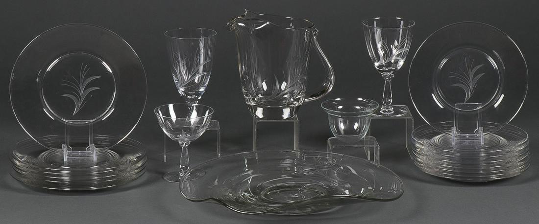 64 PC FOSTORIA SPRAY STEMWARE SET: 64 PC FOSTORIA SPRAY STEMWARE SET. Comprising 64 individual pieces including wine glasses, water glasses, sherbets, inserts, luncheon plates, center piece, and water pitcher. Underside of all stemware