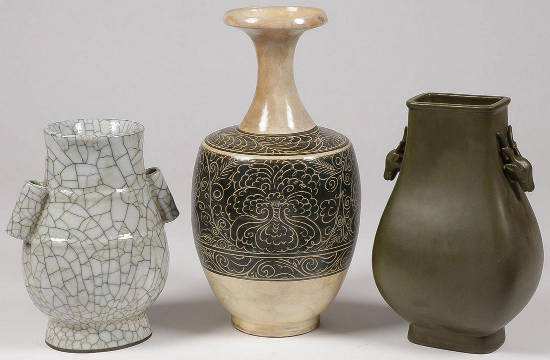 THREE ASIAN VASES: THREE ASIAN VASES. Comprising three vases of different shapes, surfaces, and glazes, including a moss green tea dust vase with deer heads and impressed reign mark on underside of base, together with a