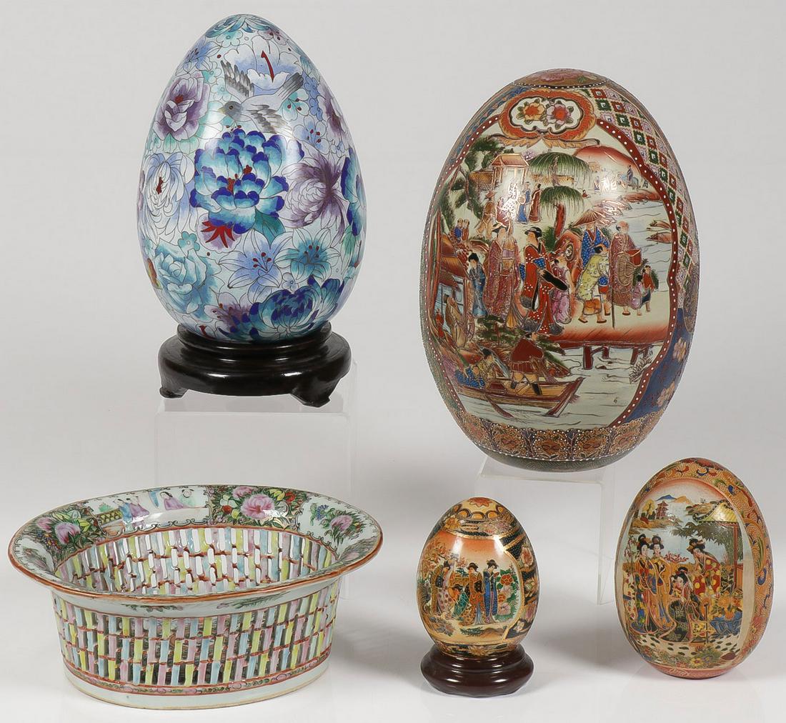 ASIAN DECORATIVE ARTS GROUP: ASIAN DECORATIVE ARTS GROUP. Comprising five individual pieces including a large cloisonné decorated egg, three ceramic decorated eggs, and a canton pierced basket. Greatest measurement 12 inches. SH