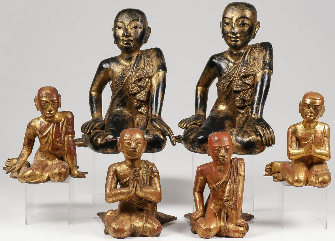 A GROUP OF BUDDHIST DISCIPLES FIGURES: A GROUP OF BUDDHIST DISCIPLES FIGURES. Comprising three pairs of gilt wood and lacquer figures depicting Buddhist disciples, Shariputra and Maudgalyayana, the four larger figures with inlaid colored g