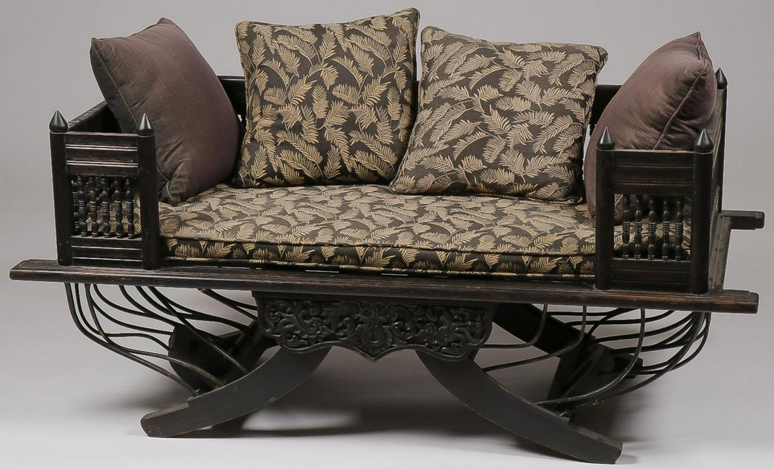 A PAIR OF HOWDAH STYLE SOFAS: A PAIR OF HOWDAH STYLE SOFAS. Two wooden howdah style benches with removable upholstered seats. 27.5 inches x 60 inches x 27 inches. SHIPPING NOTICE: Jackson's is your sole and only source for