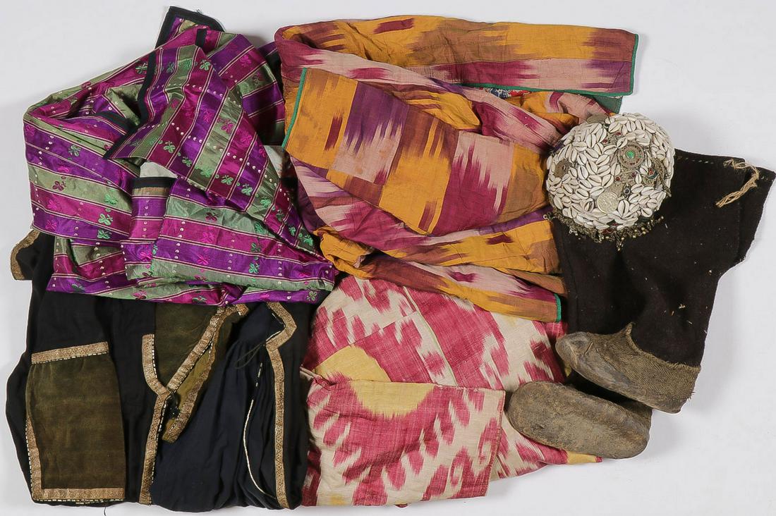 EXTENSIVE CHINESE/MONGOL CLOTHING GROUP: EXTENSIVE CHINESE/MONGOL CLOTHING GROUP. Including 5 knee-length cloaks of various size and textiles, as well as hand-woven pieces, wool-top boots, a shell-covered hat with coins and other embellishme