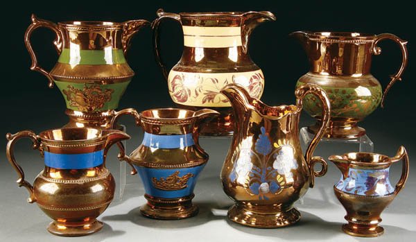 A 7 PIECE GROUPING OF COPPER LUSTRE PITCHERS, lat