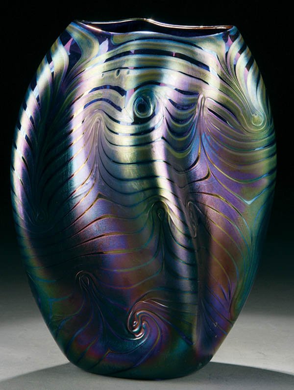 A CONTEMPORARY GLASS VASE, twisted free form in i