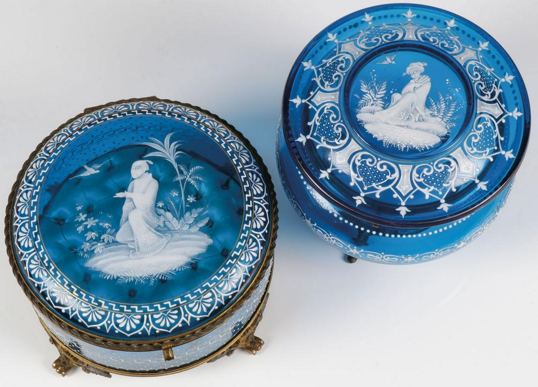 TWO EXCEPTIONAL MARY GREGORY BOXES, C. 1890: TWO EXCEPTIONAL MARY GREGORY BOXES, C. 1890. Comprising two large and impressive Bohemian (AKA Mary Gregory) enamel decorated sapphire blue glass boxes in the Oriental taste, each with hinged lid fine