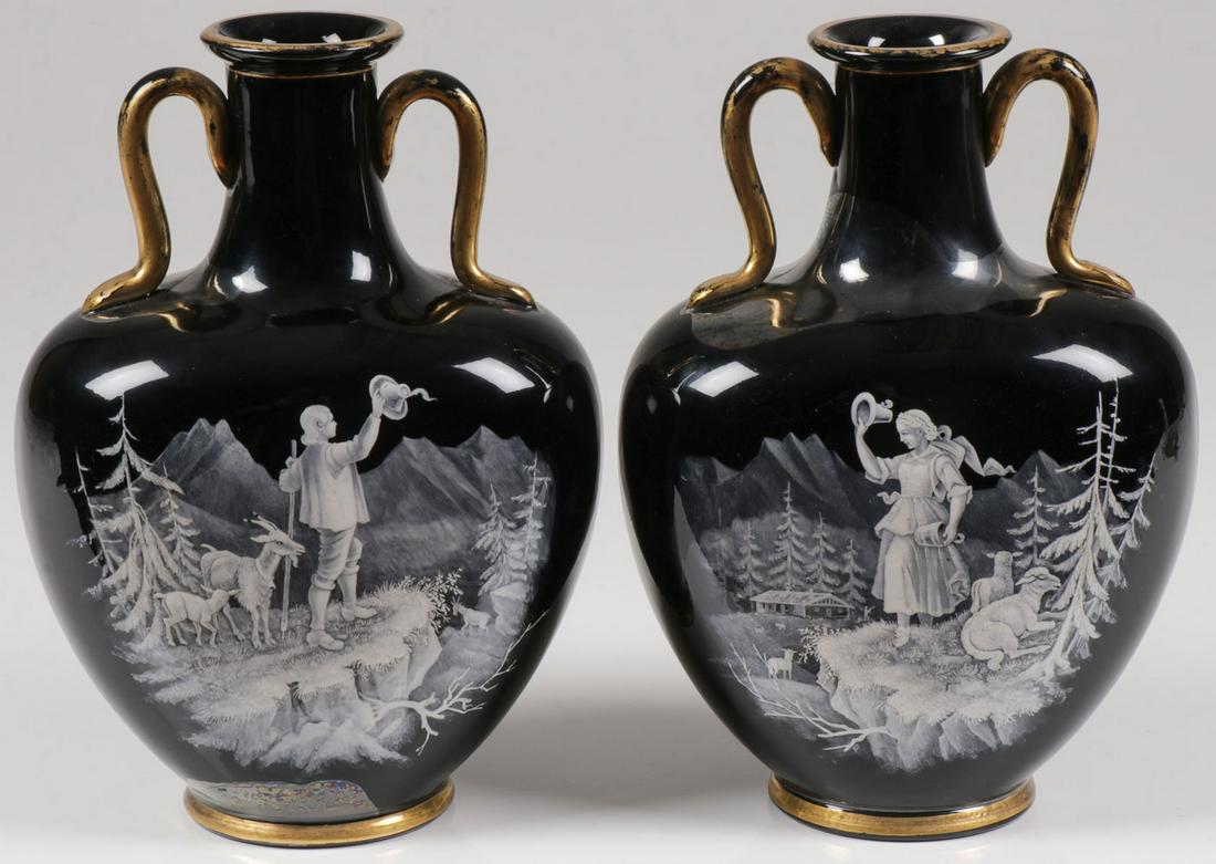 A PAIR OF MARY GREGORY PILLOW VASES, C. 1880: A PAIR OF MARY GREGORY PILLOW VASES, C. 1880. Comprising a pair of Bohemian (AKA Mary Gregory) enamel decorated black glass heart shaped pillow vases, each finely enameled with a scene of an alpine sh