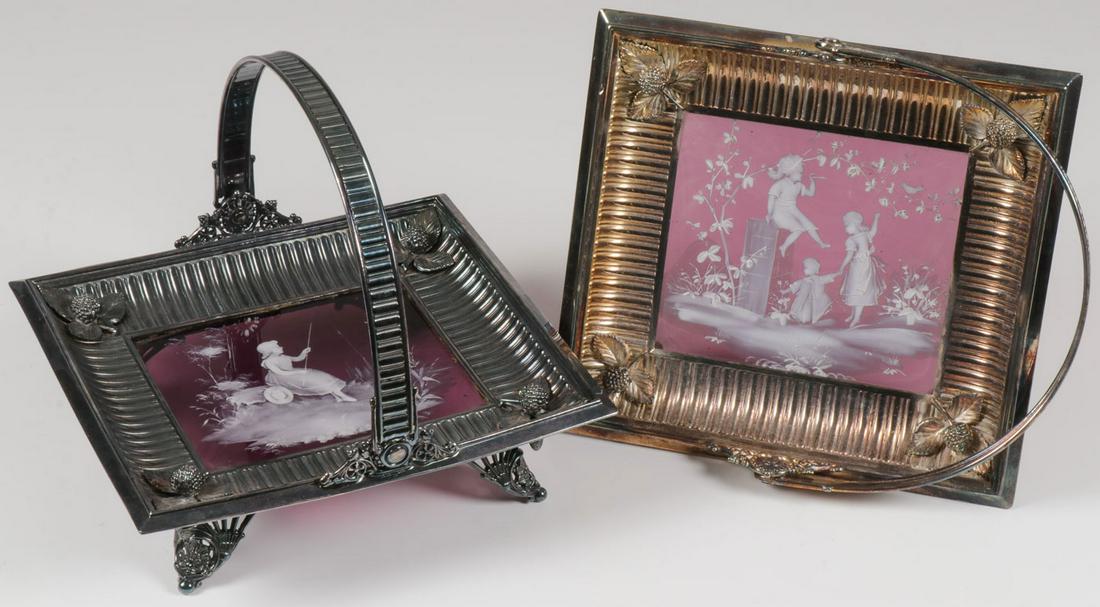 A PAIR OF MARY GREGORY BASKETS: A PAIR OF MARY GREGORY BASKETS. Comprising a pair of Bohemian (AKA Mary Gregory) enamel decorated glass baskets with metal frames, both baskets with square amethyst inserts one enameled with a girl fi