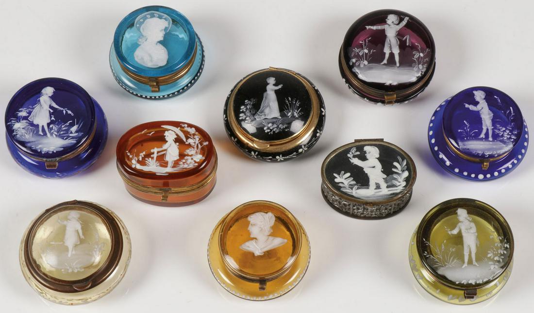 10 MARY GREGORY PILL BOXES, CIRCA 1900: 10 MARY GREGORY PILL BOXES, CIRCA 1900. Comprising ten individual Bohemian (AKA Mary Gregory) art glass pill boxes of various shapes and colors including amethyst, amber, sapphire blue, cobalt blue, a