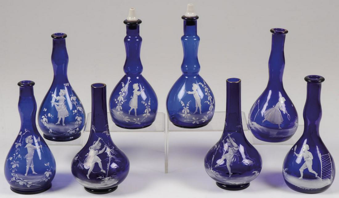 4 MARY GREGORY BARBER BOTTLE SETS, C. 1890: 4 MARY GREGORY MATCHING BARBER BOTTLE SETS, C. 1890. Comprising 8 individual bottles making up 4 matching sets of Bohemian (AKA Mary Gregory) enamel decorated glass barber bottles, each in cobalt blue