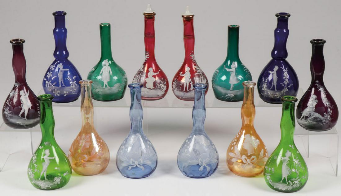 7 MARY GREGORY MATCHING BARBER BOTTLE SETS C 1890: SEVEN MARY GREGORY MATCHING BARBER BOTTLE SETS, CIRCA 1890. Comprising 14 individual bottles making up 7 matching sets of Bohemian (AKA Mary Gregory) enamel decorated glass barber bottles of various c