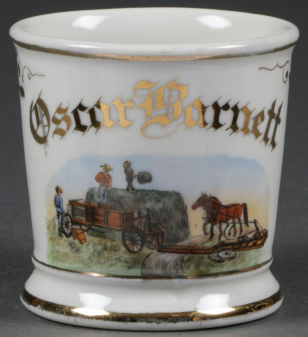 A FINE OCCUPATIONAL SHAVING MUG, C. 1890: A FINE OCCUPATIONAL SHAVING MUG, C. 1890. Named to an Oscar Barnett and decorated with three farmers bailing hay with horse driven mechanism. Height 3.5 inches. Provenance: Lifetime collection of Dr.