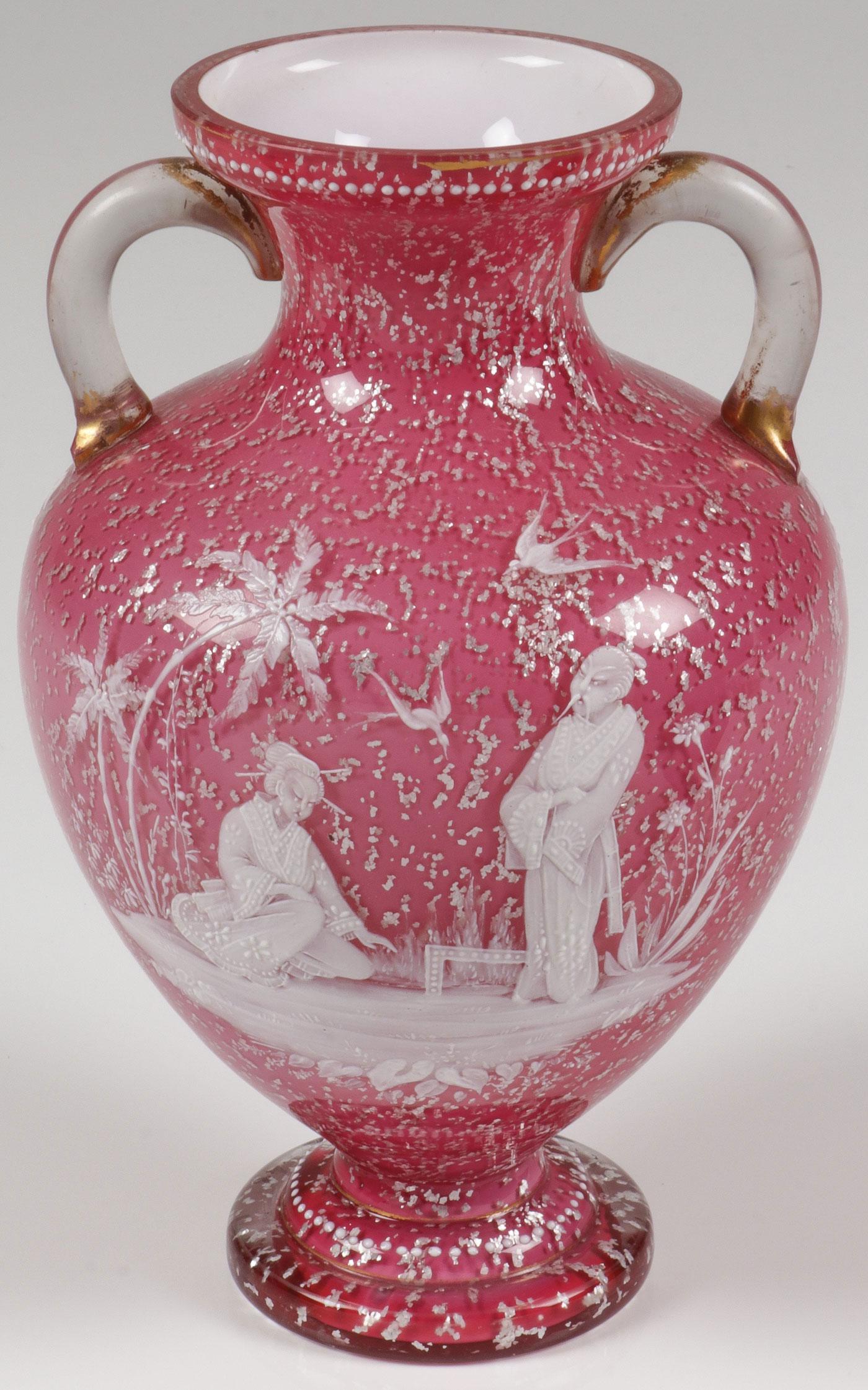 AN ENAMELED CASED GLASS VASE, C. 1890: AN ENAMELED CASED GLASS VASE, C. 1890. Comprising an attractive Bohemian (AKA Mary Gregory) pink cased glass classical urn shaped vase with silver flecks and enameled with an Oriental scene of a man a