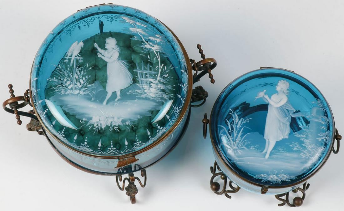 PAIR OF LARGE MARY GREGORY BOXES, C. 1890: PAIR OF LARGE MARY GREGORY BOXES, C. 1890. Comprising a pair of impressive Bohemian (AKA Mary Gregory) enamel decorated sapphire blue glass boxes, each of circular form and each within a gilt wire fra