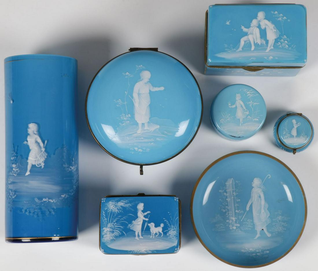 7 PCS MARY GREGORY IN POWDER BLUE, C. 1890: 7 PCS MARY GREGORY IN POWDER BLUE, C. 1890. Comprising seven individual pieces of Bohemian (AKA Mary Gregory) enamel decorated glass. Each rendered in robin's egg or powder blue, including a large cyl