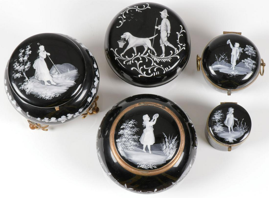 FIVE MARY GREGORY AMETHYST BOXES, C. 1900: FIVE MARY GREGORY AMETHYST BOXES, C. 1900. Comprising five Bohemian (aka Mary Gregory) enamel decorated amethyst glass boxes of circular form. Four with hinged lids and one with integral glass ball f