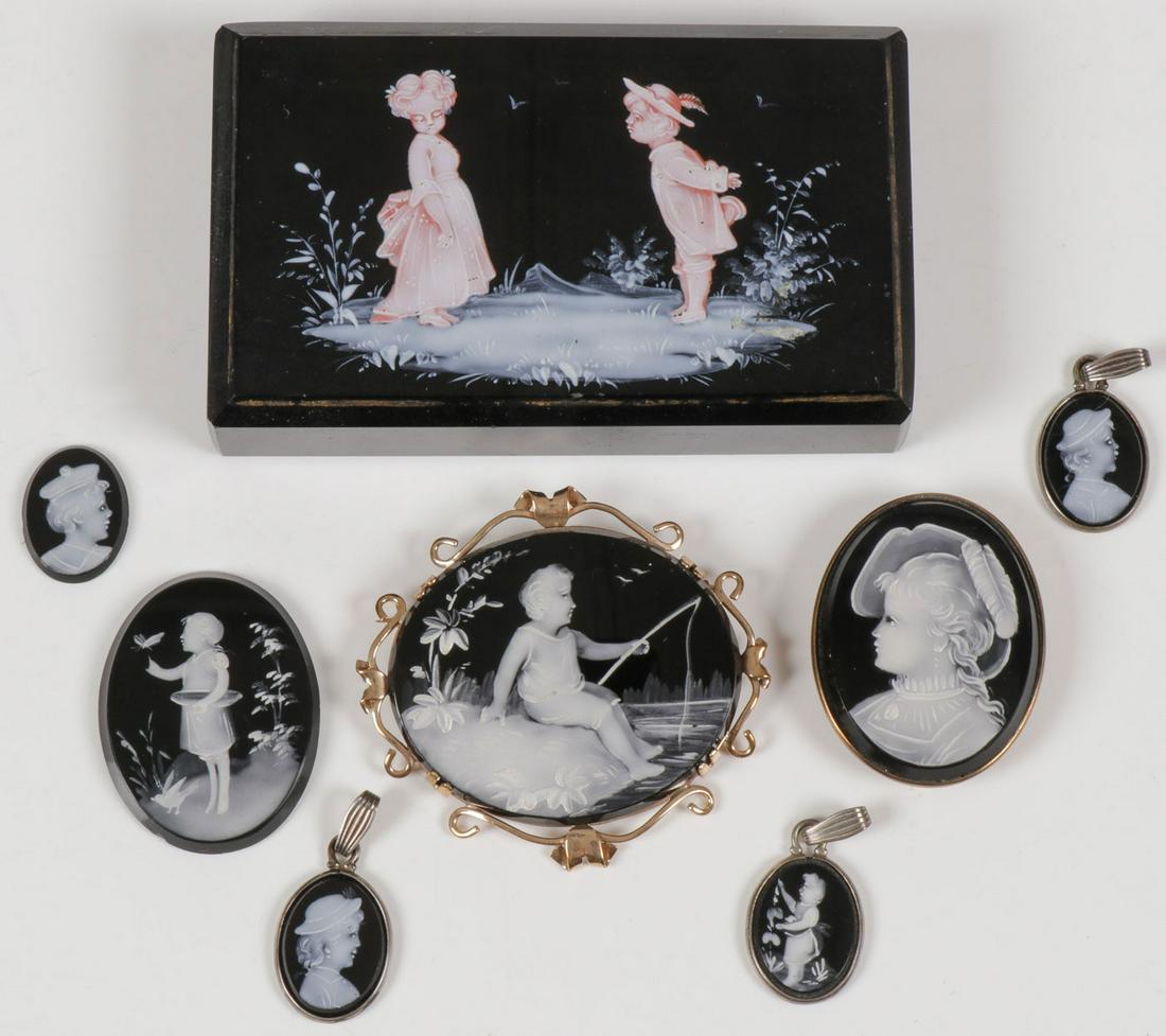 MARY GREGORY JEWELRY & MORE, C. 1900: MARY GREGORY JEWELRY & MORE, C. 1900. Comprising eight individual pieces of Bohemian (AKA Mary Gregory) enamel decorated black glass objects including a rectangular paperweight painted with a cute boy
