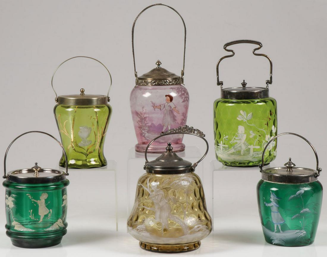 SIX MARY GREGORY CRACKER JARS, C. 1900-20: SIX MARY GREGORY CRACKER JARS, C. 1900-20. Comprising six individual Bohemian (AKA Mary Gregory) art glass cracker jars of various shapes and colors. Each enameled with various subjects and mounted wi
