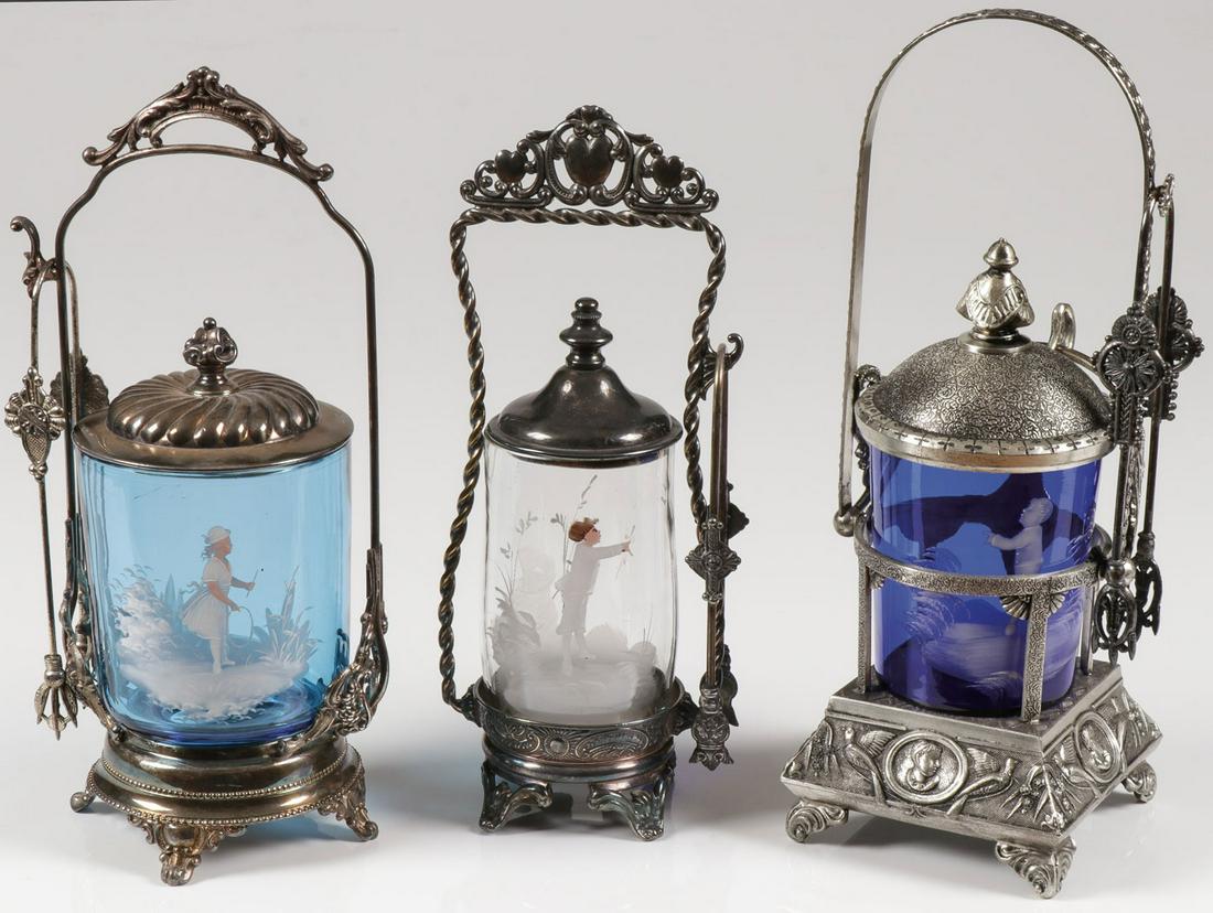 THREE MARY GREGORY PICKLE CASTERS: THREE MARY GREGORY PICKLE CASTERS. Comprising three individual Bohemian (AKA Mary Gregory) enamel decorated pickle casters of various shapes, sizes, and colors, including a sapphire blue example decor