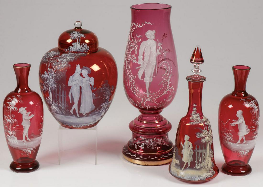 FIVE PIECES MARY GREGORY CRANBERRY GLASS: FIVE PIECES MARY GREGORY CRANBERRY GLASS. Comprising five individual pieces Bohemian (AKA Mary Gregory) enamel decorated cranberry glass including a large baluster form vase with gilt banding and a f