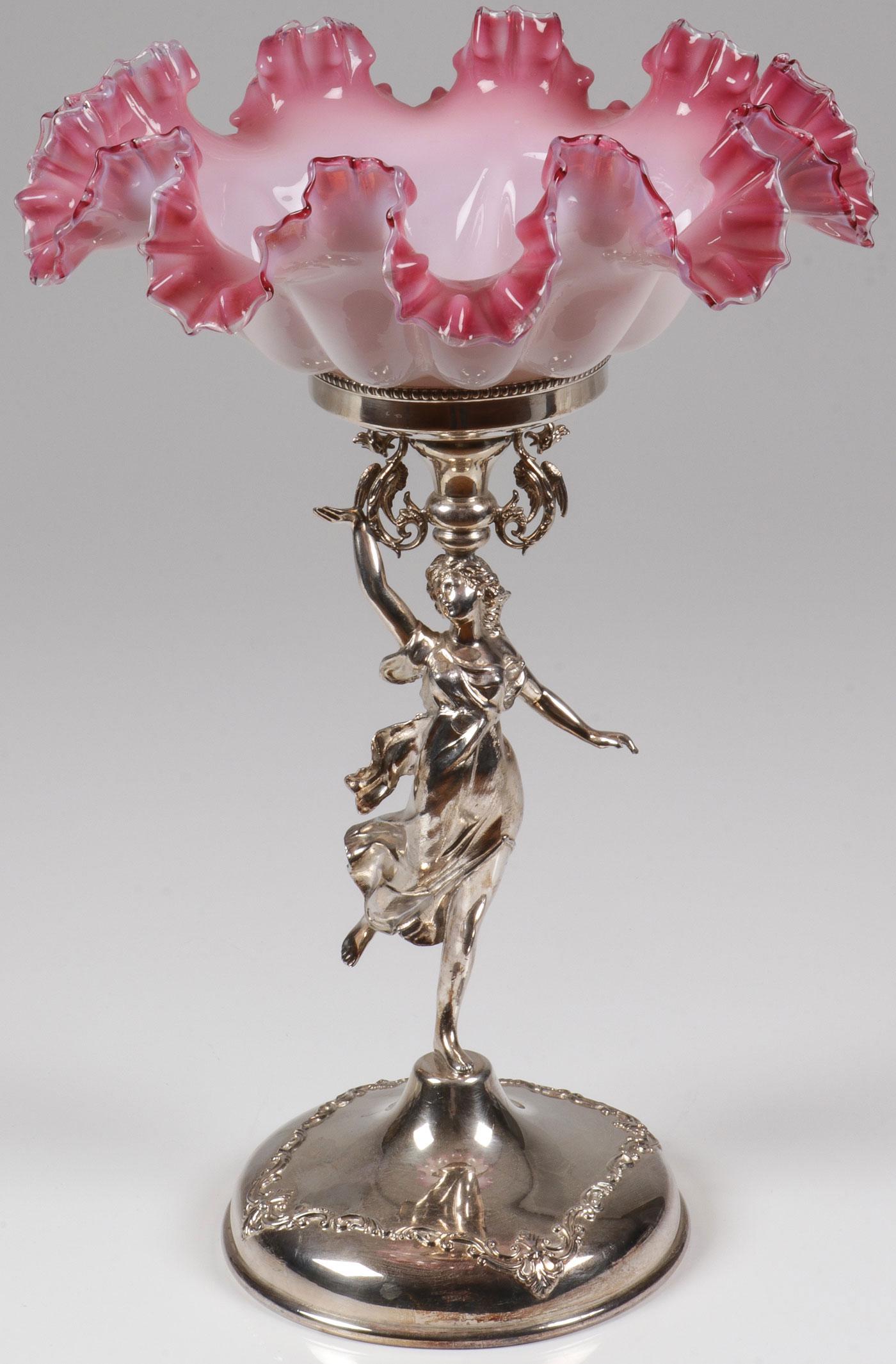 SPECTACULAR VICTORIAN FIGURAL CENTERPIECE, C 1875: SPECTACULAR VICTORIAN FIGURAL CENTERPIECE, C. 1875. Comprising a large and impressive Barbour Silver Company plated figural stand depicting a beautiful woman supporting a conical socket base flanked b