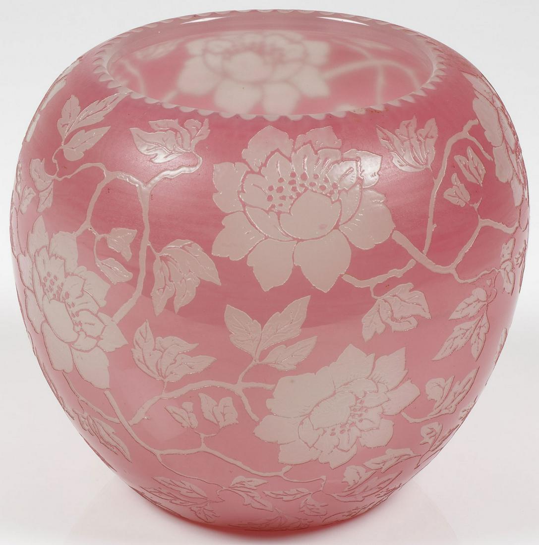 A STEUBEN ROSALINE ACB VASE, EARLY 20TH C.: A STEUBEN ROSALINE ACB VASE, EARLY 20TH C. Of ovoid form in Rosaline over alabaster colored glass cut with a floral pattern of large blossoms and trailing leaves. Height 7.1 inches (18 cm). SHIPPING N