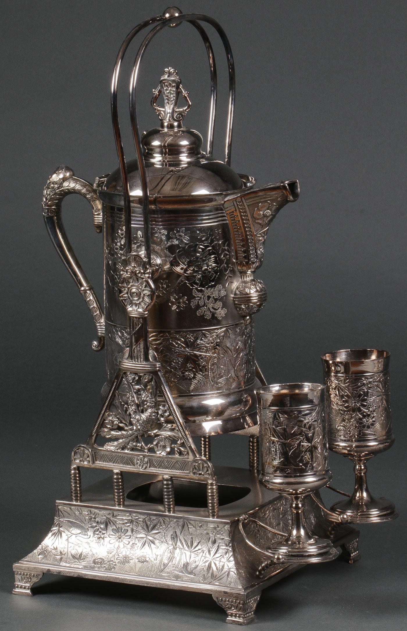 LARGE PAIRPOINT WATER PITCHER & STAND, 19TH C: EXCEPTIONAL PAIRPOINT WATER PITCHER & STAND, 19TH C. Comprising a large and impressive Pairpoint silver-plated water pitcher with conforming stand and matching goblets, the overall surface decorated i