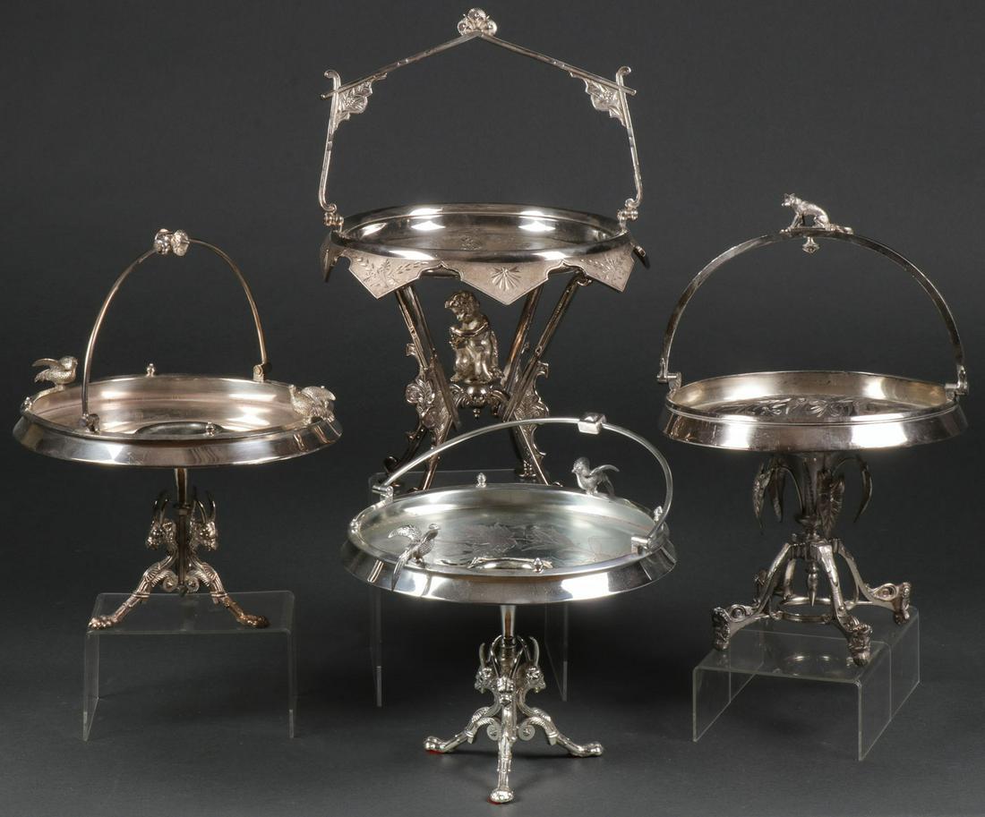 FOUR FINE AESTHETIC SILVER-PLATED FOOTED STANDS: FOUR FINE AESTHETIC SILVER-PLATED FOOTED STANDS. Including a Meriden (#751) four-footed stand, set with a bacchanal putti crushing grapes into a cup beneath a circular chased platform with overhanging