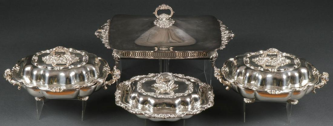 FOUR SILVER-PLATED COVERED DISHES: FOUR SILVER-PLATED COVERED DISHES. Comprising four heavy and ornate silver-plated covered serving dishes including a long rectangular Wallace Baroque (#226) silver-plated tray with ornate handles, ven